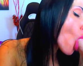 Who is this black haired beauty using her dildo